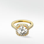 The Sequoia Diamond Engagement Ring in yellow gold, with a round diamond in a cushion halo and pavé band.